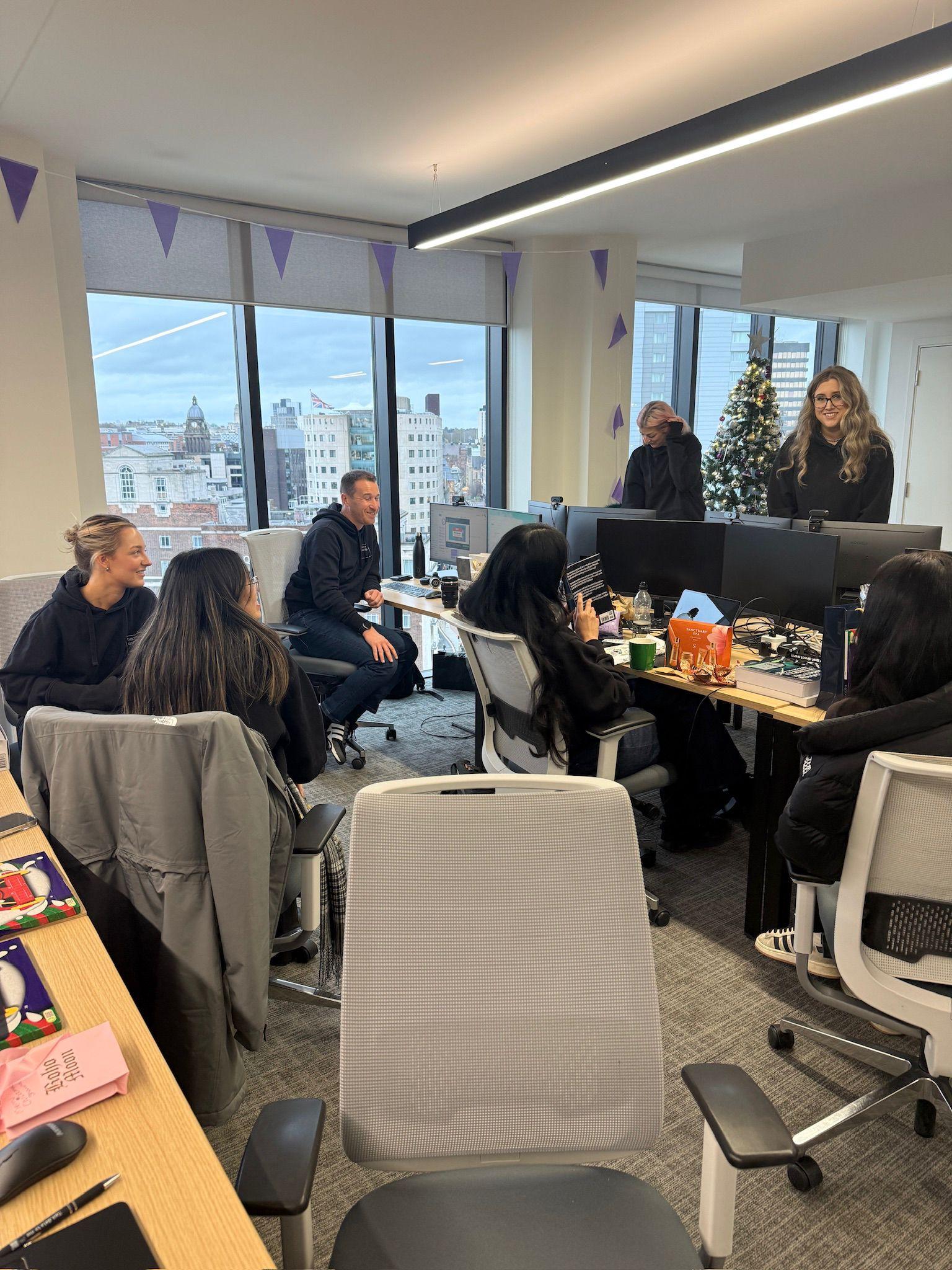 Hopton Analytics team collaborating in the office